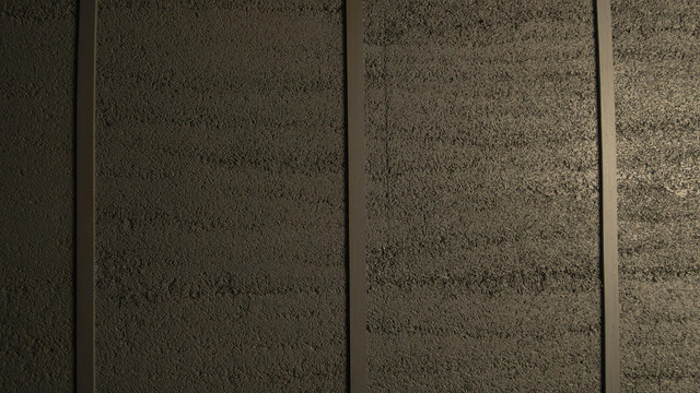 Close-up hempcrete wall texture showing natural bio-composite finish